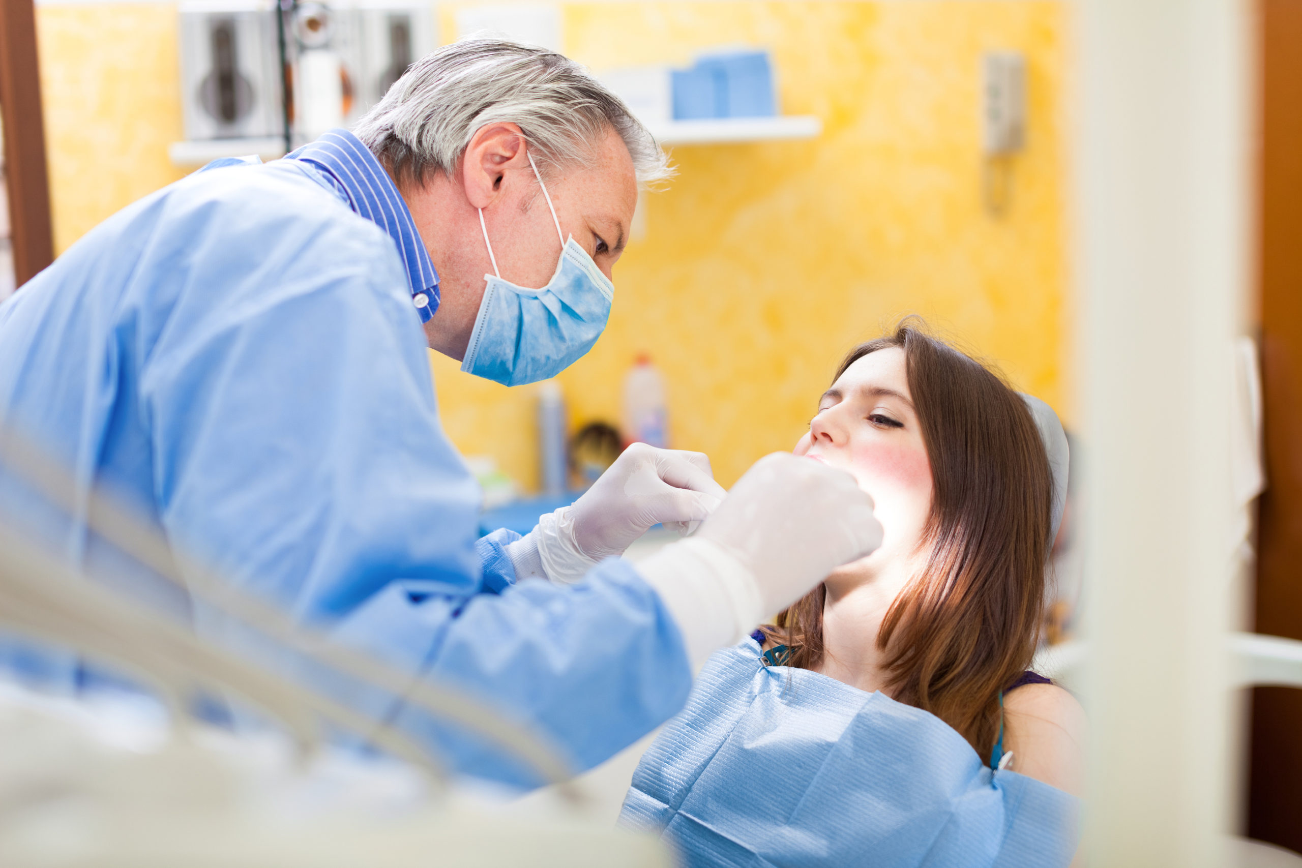 Dentist Working on Female Patient
