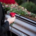 Woman Grieving at Coffin