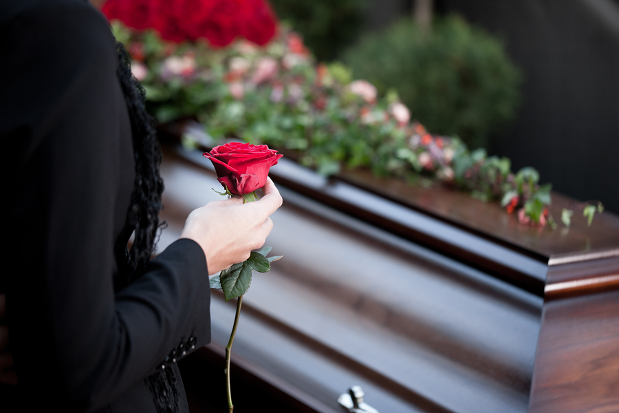 Woman Grieving at Coffin