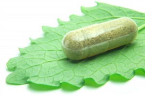 Herbal capsule on melisa leaf
