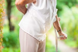 Elderly Woman walking with bad back