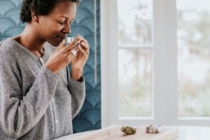black woman smelling cannabis